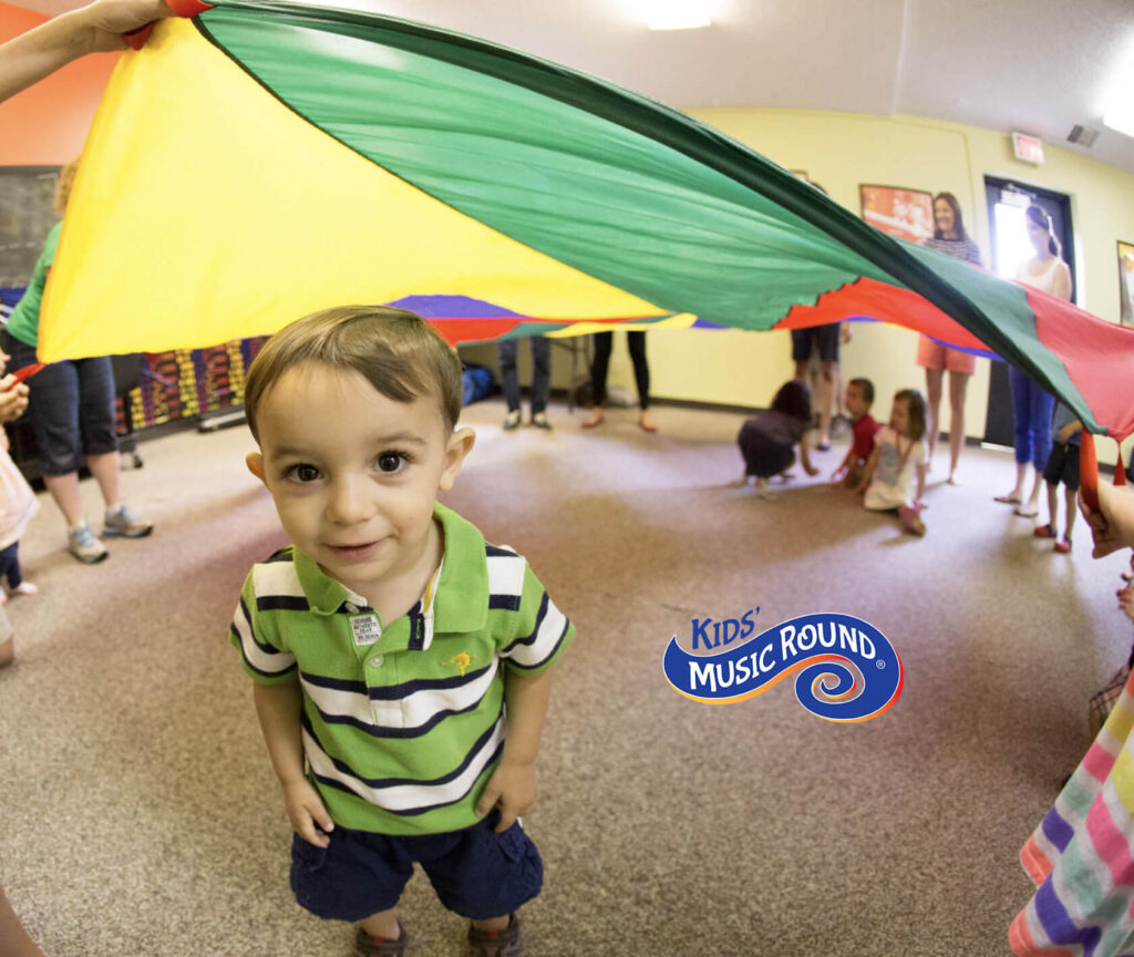 Boy under parachute