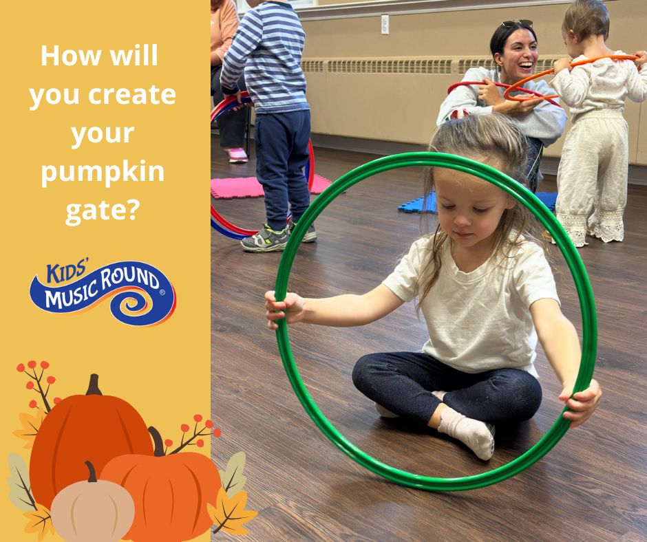 Three young boys sitting around a colorful drum in a music classroom
