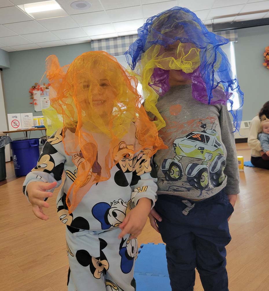 Children with colorful pumpkin crafts