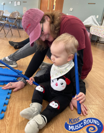 Mommy & child making music with sticks Spending time making music with sticks (baby & mommy)