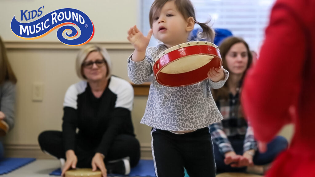 girl playing the tambourine