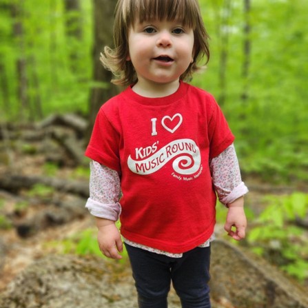 Child exploring found sounds during a preschool nature sound walk